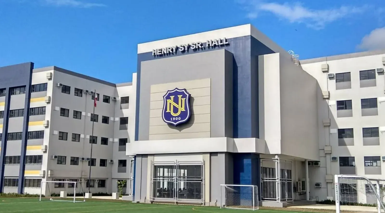 An NU campus building beside a football field