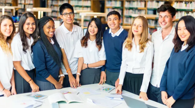 NU students gathered around a library table